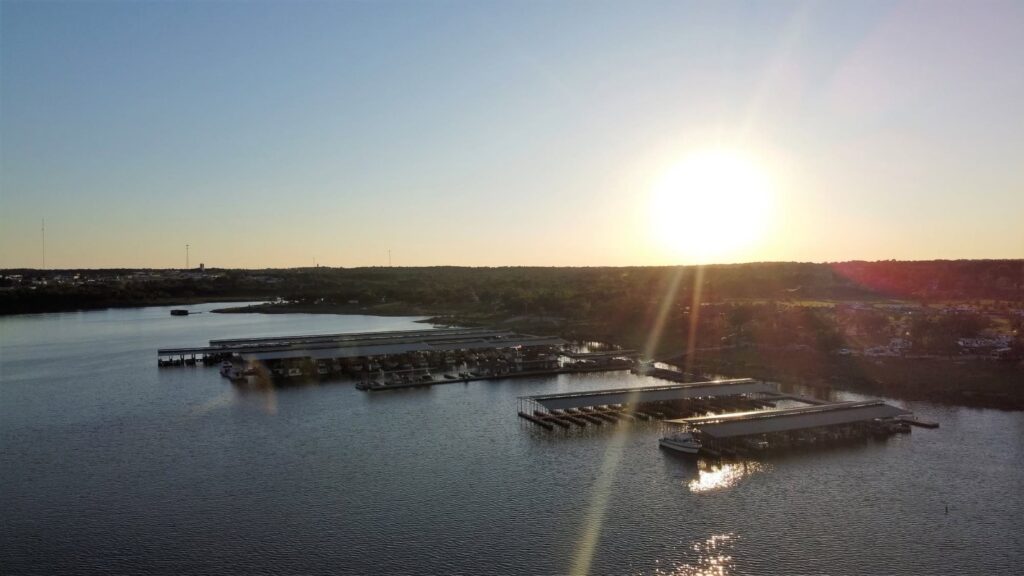 Aerial view of G Dock with covered slips and cupola roofs at Keystone Harbor Marina on Lake Keystone, Mannford, Oklahoma