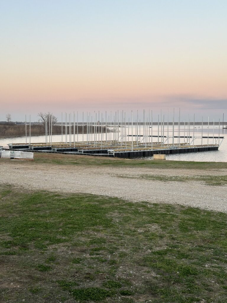 Pile-guided floating dock construction at Scott's Landing Marina on Lake Grapevine, Texas