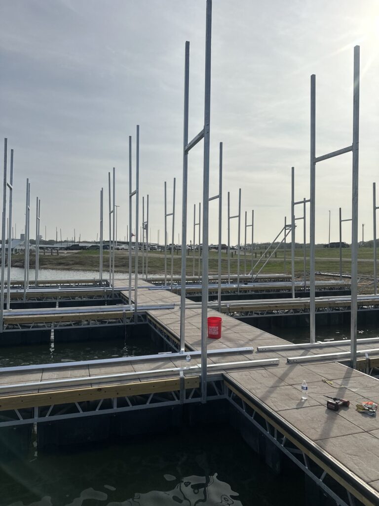 Pile-guided floating dock construction at Scott's Landing Marina on Lake Grapevine, Texas