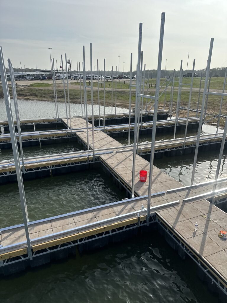 Pile-guided floating dock construction at Scott's Landing Marina on Lake Grapevine, Texas