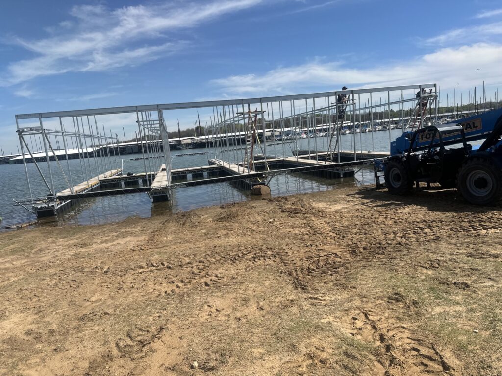 Pile-guided floating dock construction at Scott's Landing Marina on Lake Grapevine, Texas