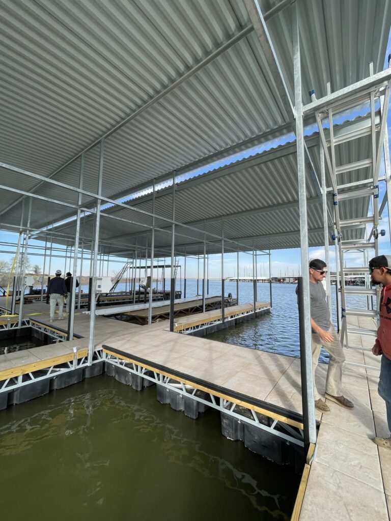 Pile-guided floating dock construction at Scott's Landing Marina on Lake Grapevine, Texas